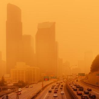 City view hazy and orange with wildfire smoke