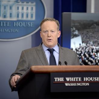 Sean Spicer speaking on the podium at the White House