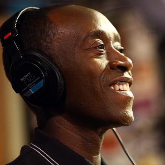 Don Cheadle with headphones on