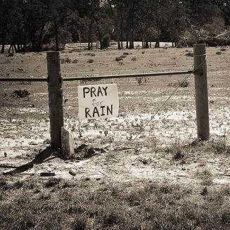 Sign that says &quot;Pray for rain&quot;
