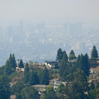 Downtown Oakland, CA skyline obscured by wildfire smoke.