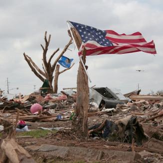 American flag amidst a junkyard