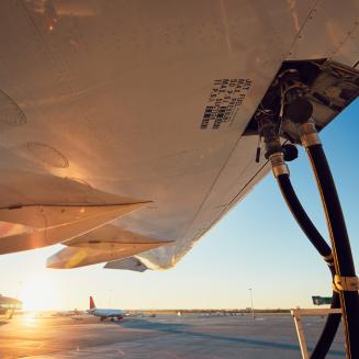 Refueling of an airplane before flight, shown close up.