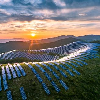 Solar panel installation on mountains with sunrise