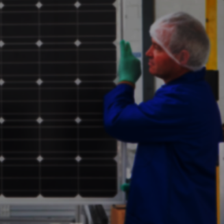 A person holding a solar panel