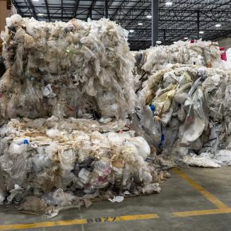 Overflowing pallets of plastic waste.