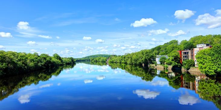 Blue sky over a reflective river