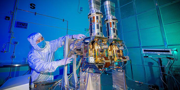 Person in lab preparing instrument for MethaneSAT methane-tracking satellite