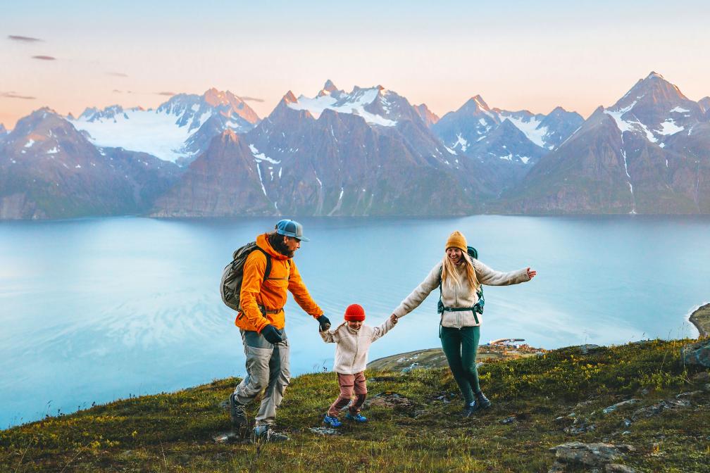 Family hiking on snowy mountain