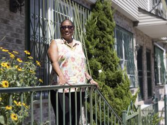 Pamela Pettyjohn stands outside her home
