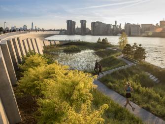 People jog through the recreated tidal marshes at Hunters Point