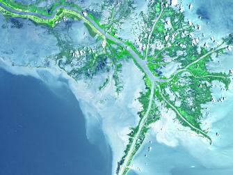 Aerial view of waters spilling out into the Gulf of Mexico where their suspended sediment is deposited to form the Mississippi River Delta