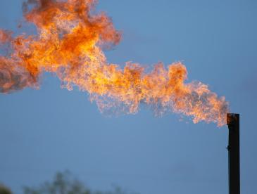 Methane flare atop smokestack
