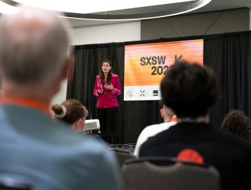 Ilissa Ocko on stage giving a talk at South by Southwest