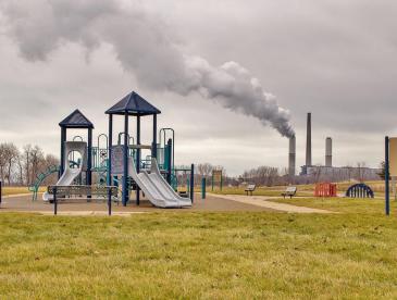 Playground with polluting facility behind it