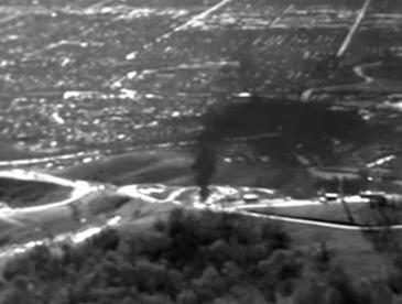 A dark plume drifts into the sky. In 2015, EDF flew over the Aliso Canyon gas leak with an infrared camera to document the pollution.