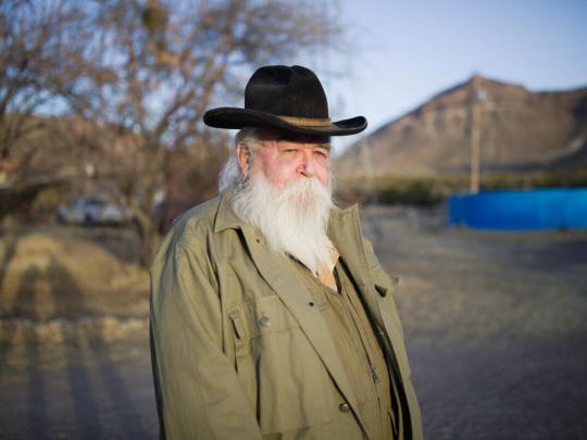Randall Cater standing in front of mountains in Texas