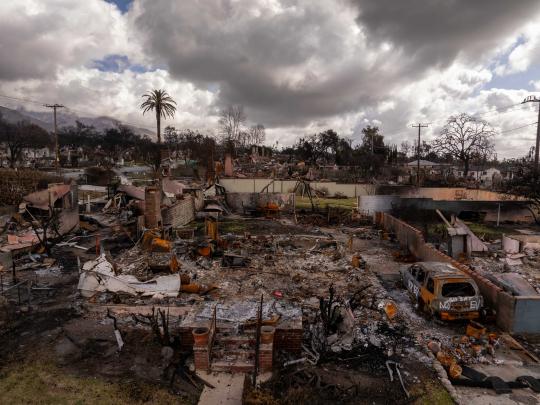 Dark clouds hang over a community in California devastated from wildfire.