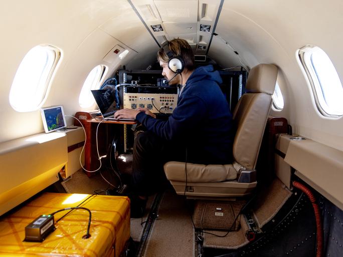 Team member and scientific equipment aboard MethaneAIR.