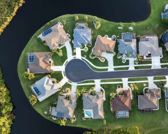 Aerial view of houses in a waterfront community.