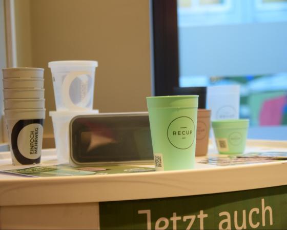 Reusable cups in a bright room.
