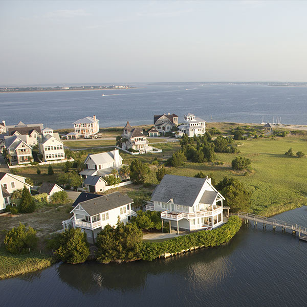 Aerial view of houses and ocean at Bald Head Island, North Carolina.