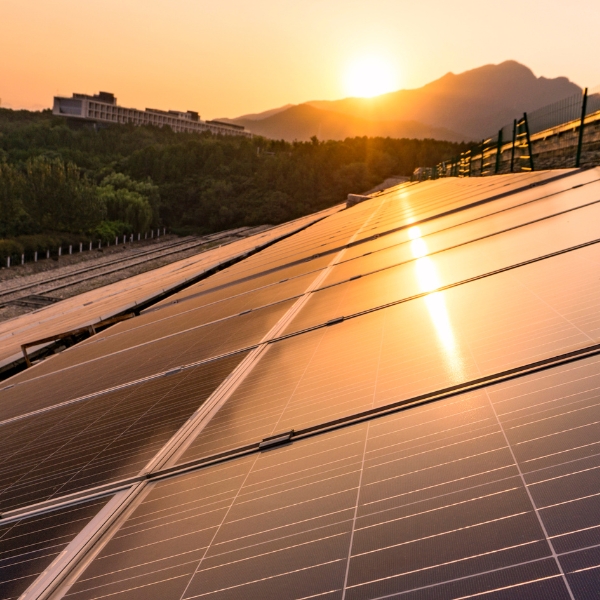 photo of a sunset over a solar farm